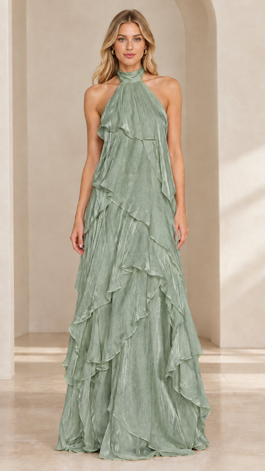 Front view of woman wearing a sage green halter neck tiered ruffle maxi dress