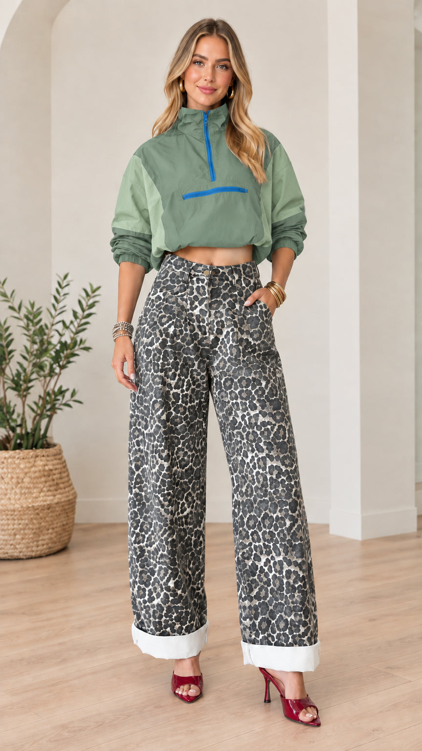 Front full view of sage green cropped half-zip windbreaker paired with leopard print wide-leg pants