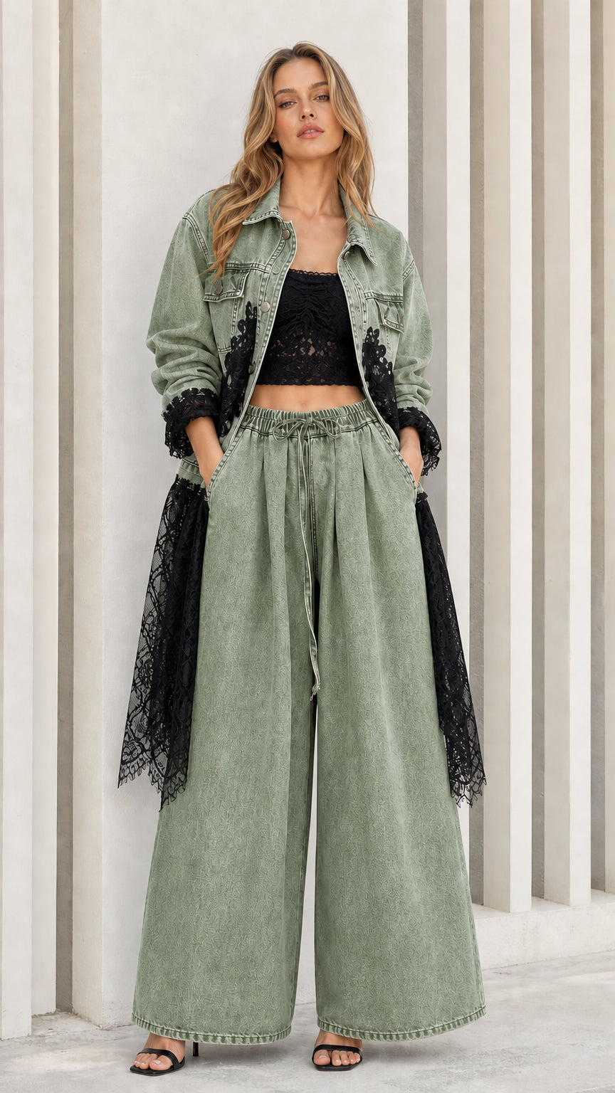 Model wearing sage green denim jacket and matching wide-leg trousers with lace trim