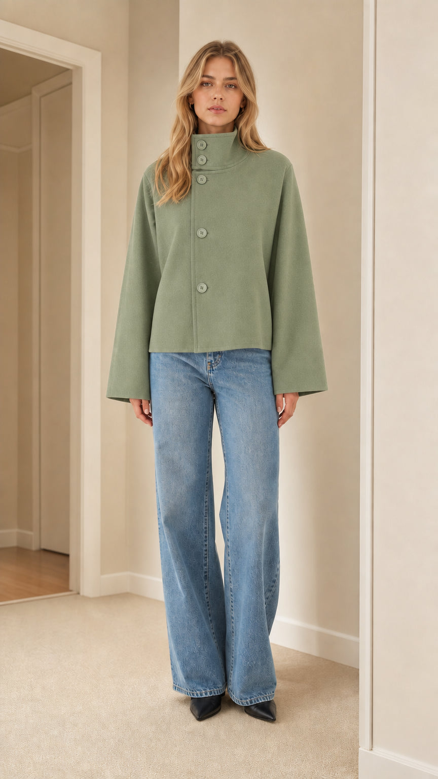 Front view of model wearing sage green high neck cropped jacket