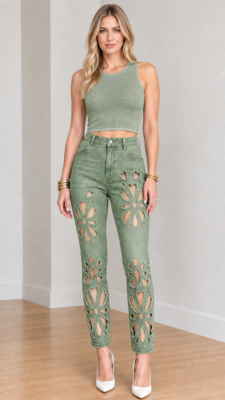 Full-length front view of model wearing sage green floral cut-out jeans with olive crop top