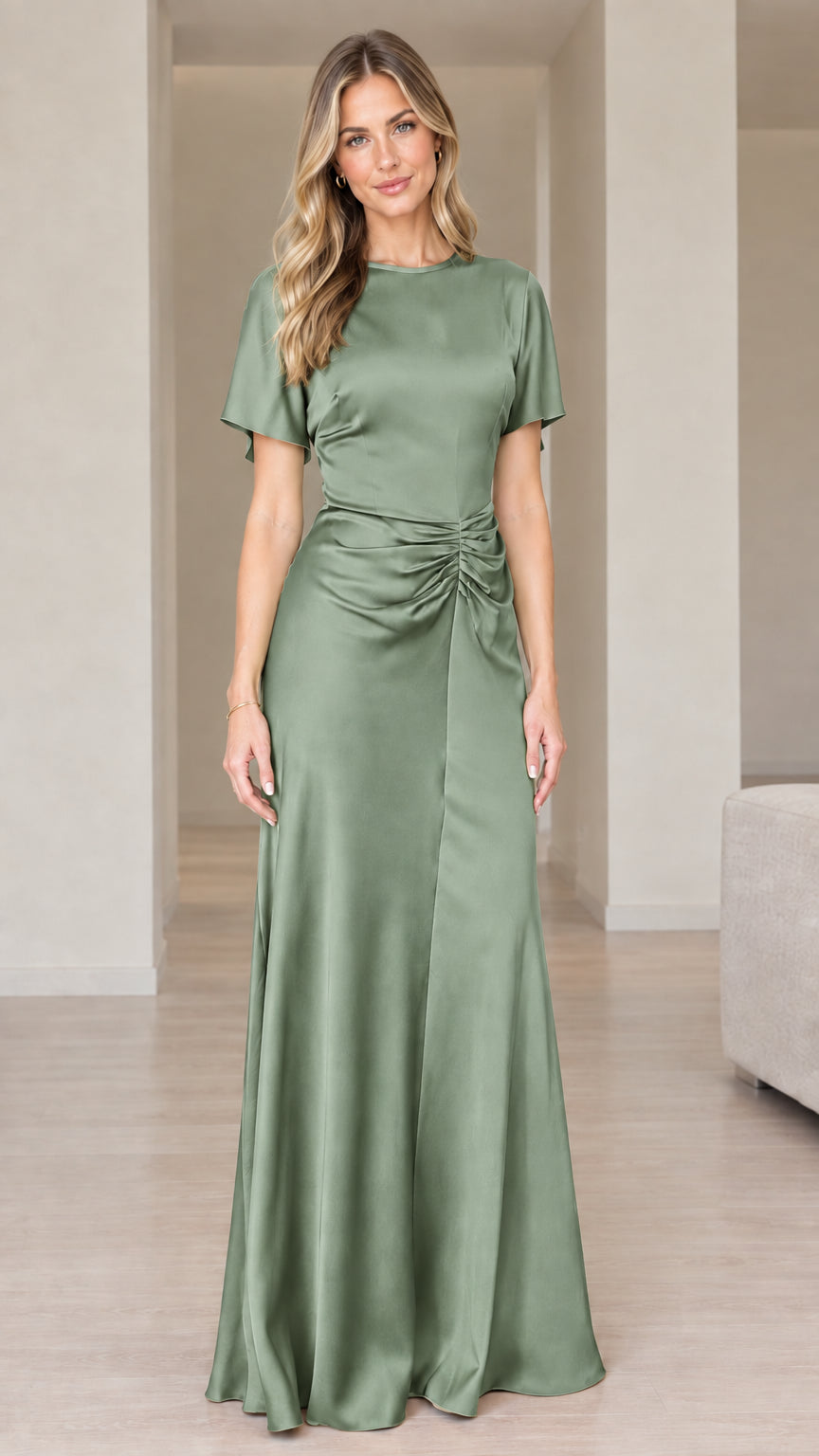 Front view of woman wearing sage green short sleeve ruched satin gown
