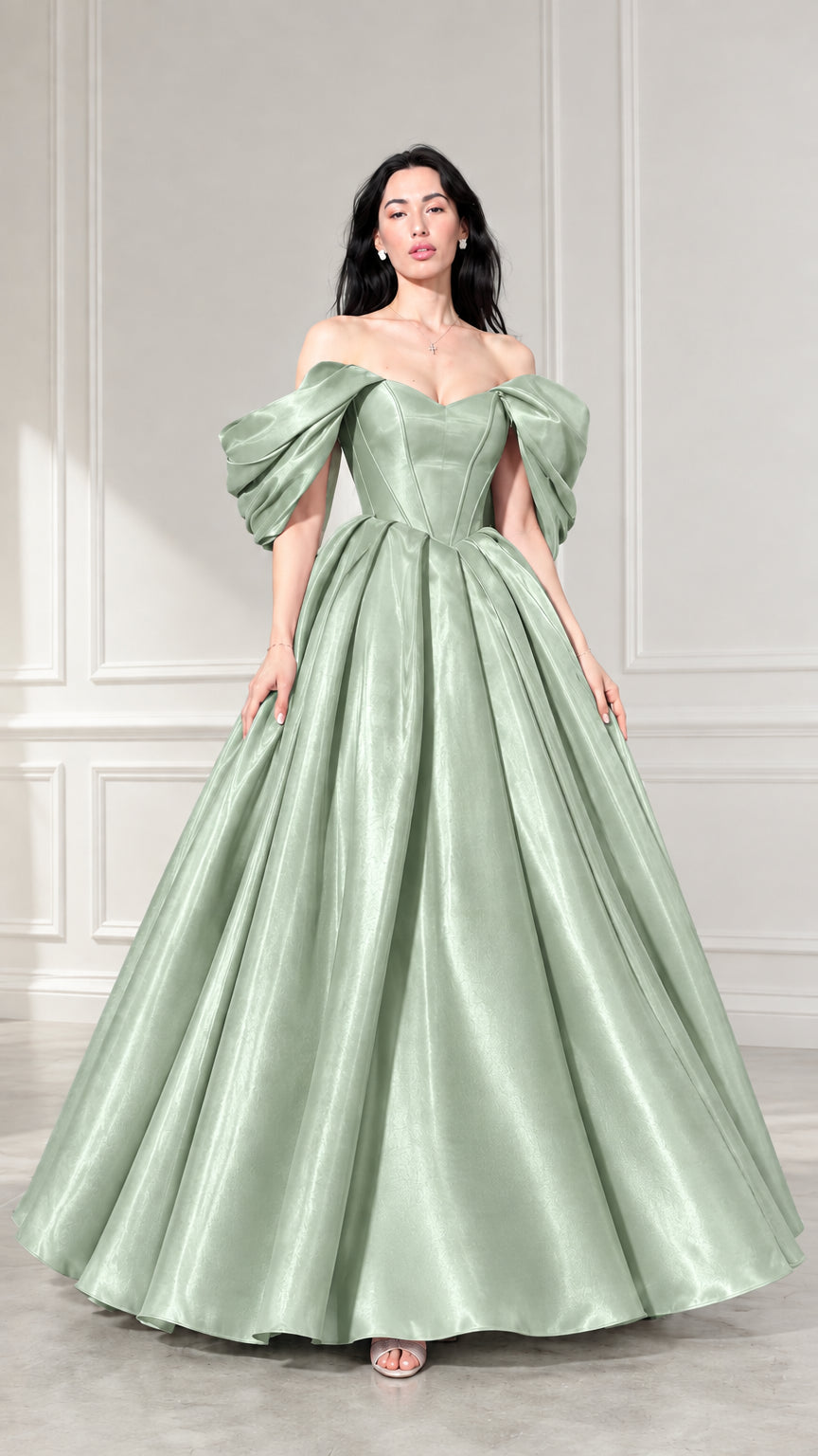 Front view of woman wearing sage green off-the-shoulder satin ball gown