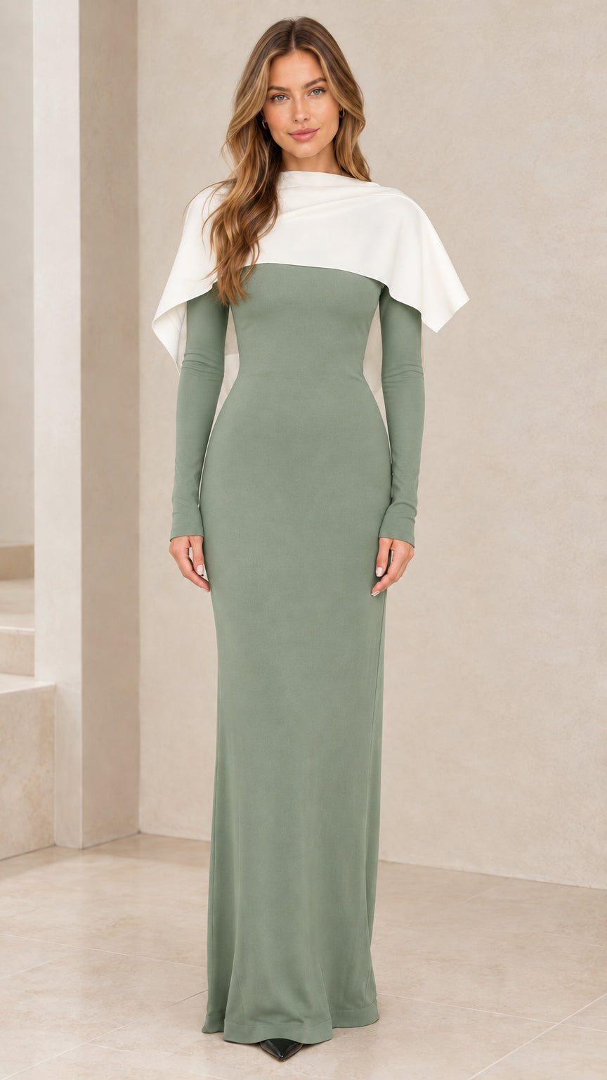 Sage green long sleeve maxi gown featuring white draped shoulder cape