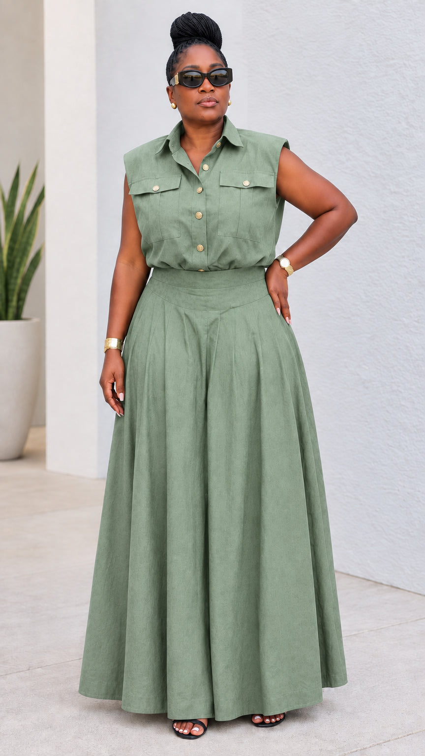 Model wearing sage green sleeveless utility top and wide-leg trousers set