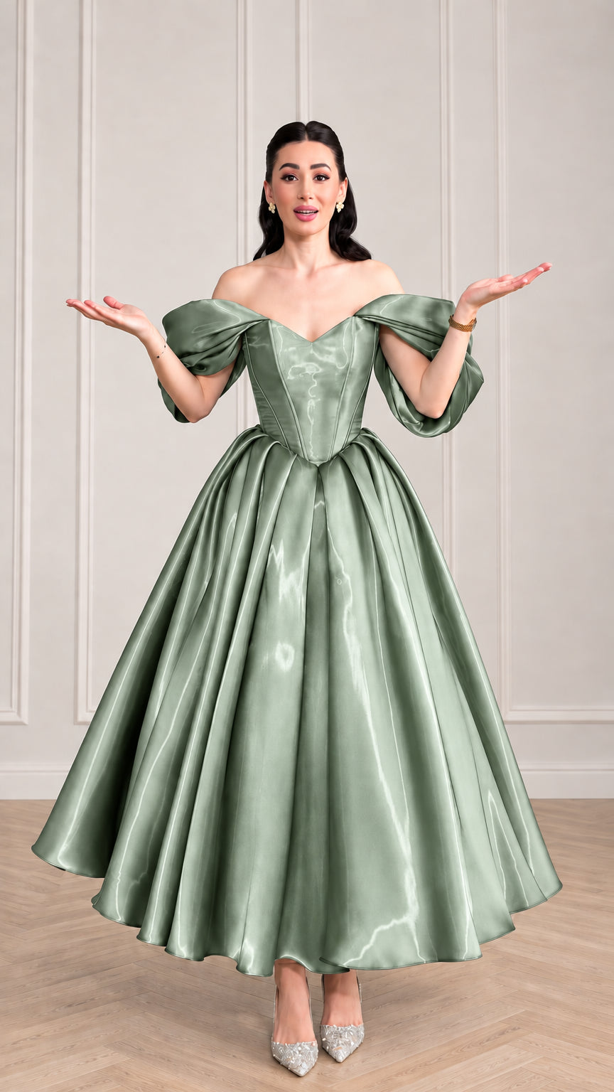 Woman wearing sage green off-the-shoulder satin corset evening dress