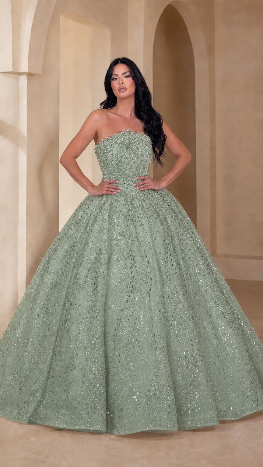 Model wearing sage green embellished strapless glitter ball gown
