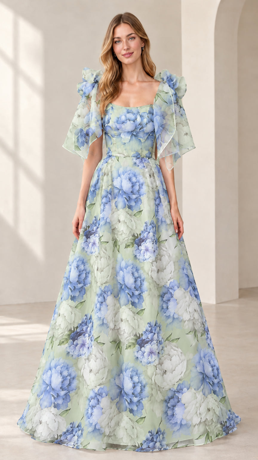 Model wearing sage green floral print flutter sleeve A-line maxi evening gown
