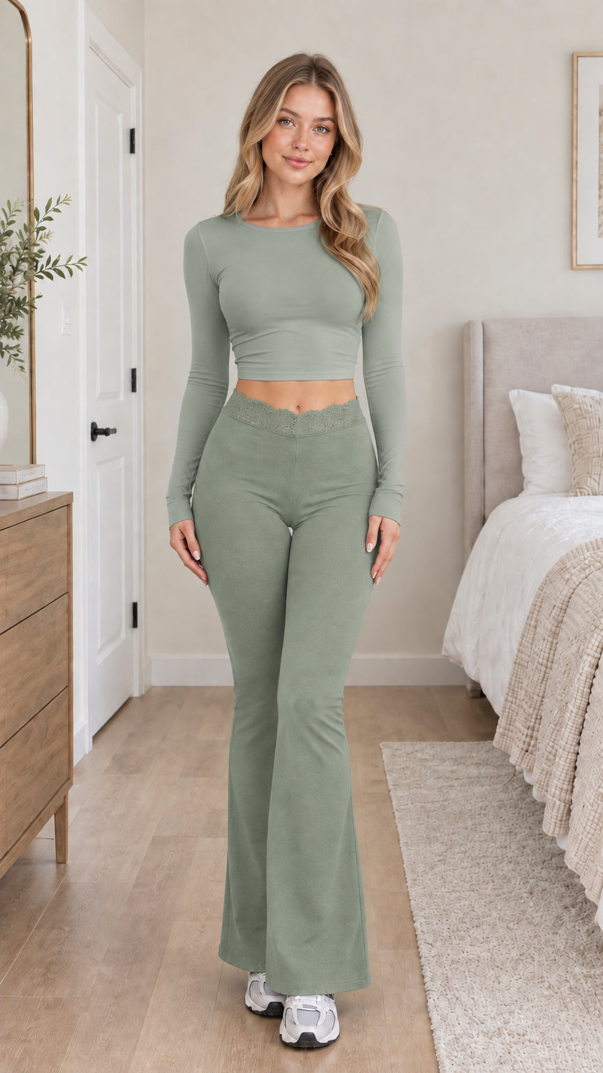 Model wearing monochromatic sage green crop top and matching lace flare pants