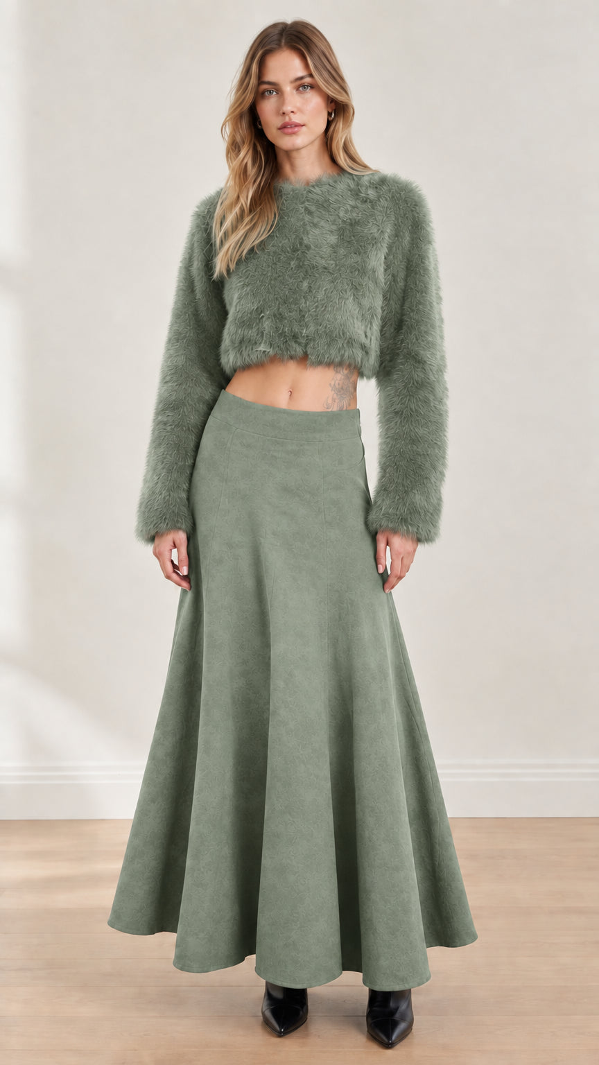 Model wearing sage green fuzzy cropped top and matching flared maxi skirt set