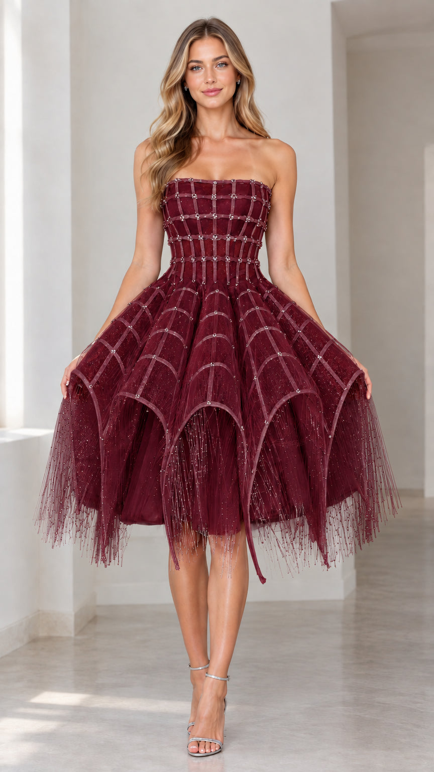 Front view of burgundy red strapless embellished corset cocktail dress with tiered fringed skirt