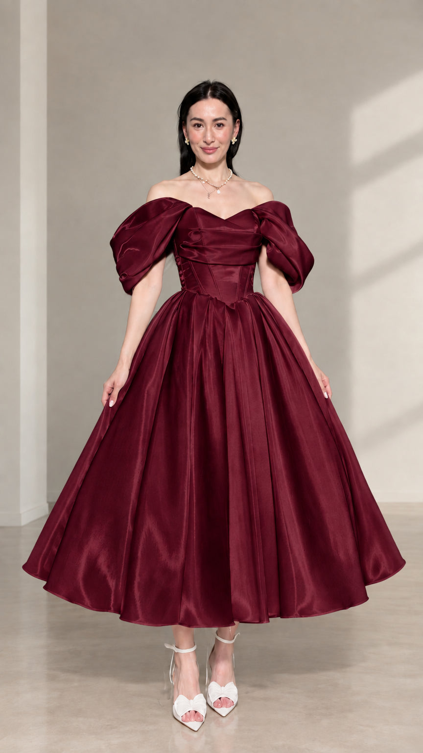 Front view of burgundy red off-the-shoulder corset satin midi dress with puff sleeves