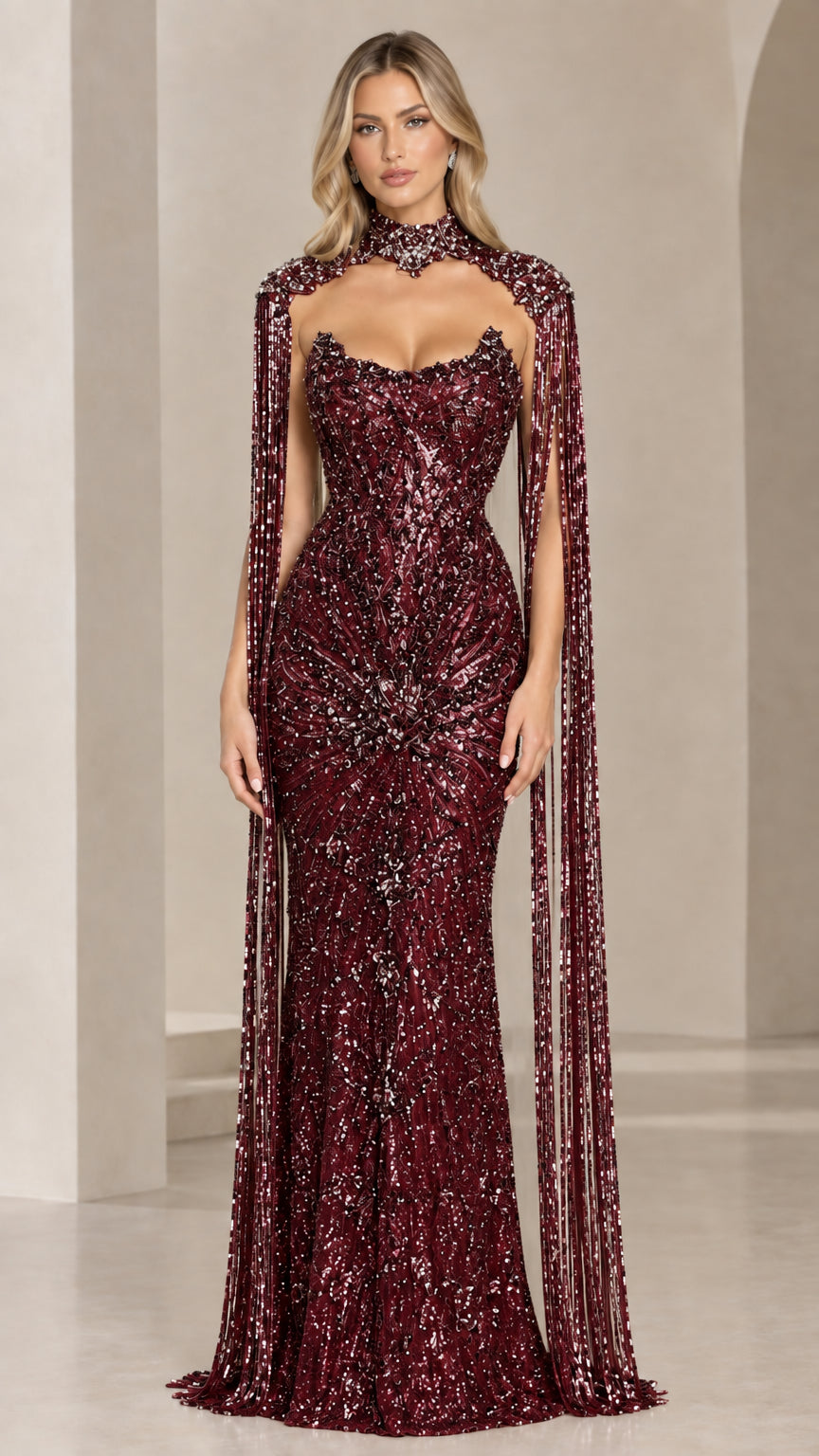 Front view of burgundy red beaded cape evening gown with allover embellishments