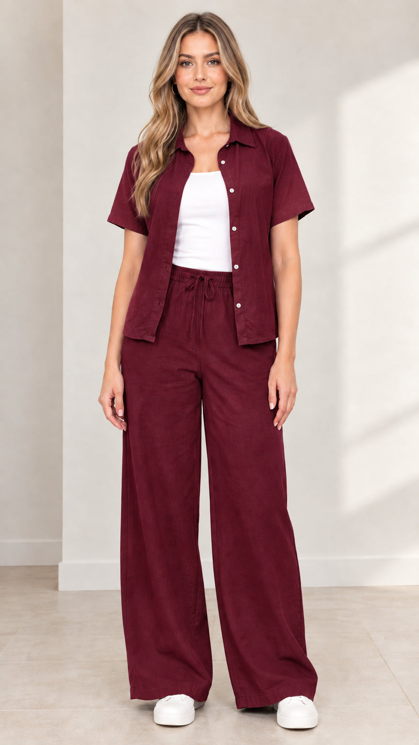 Full front view of model wearing Burgundy short-sleeve shirt and wide-leg trousers set