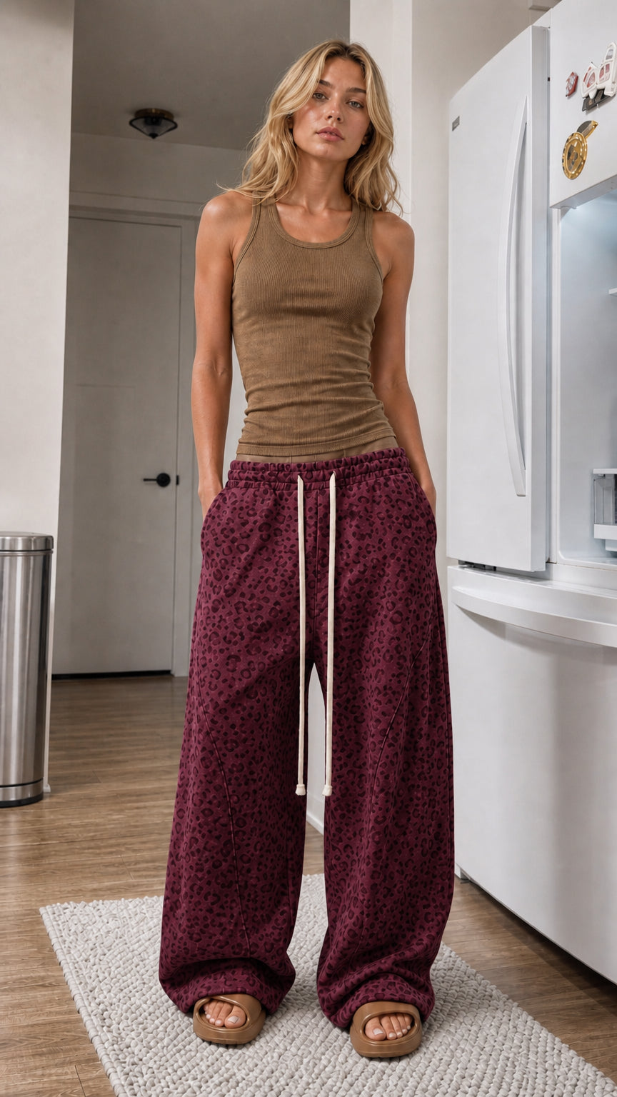 Front view of woman wearing Burgundy leopard print wide-leg sweatpants