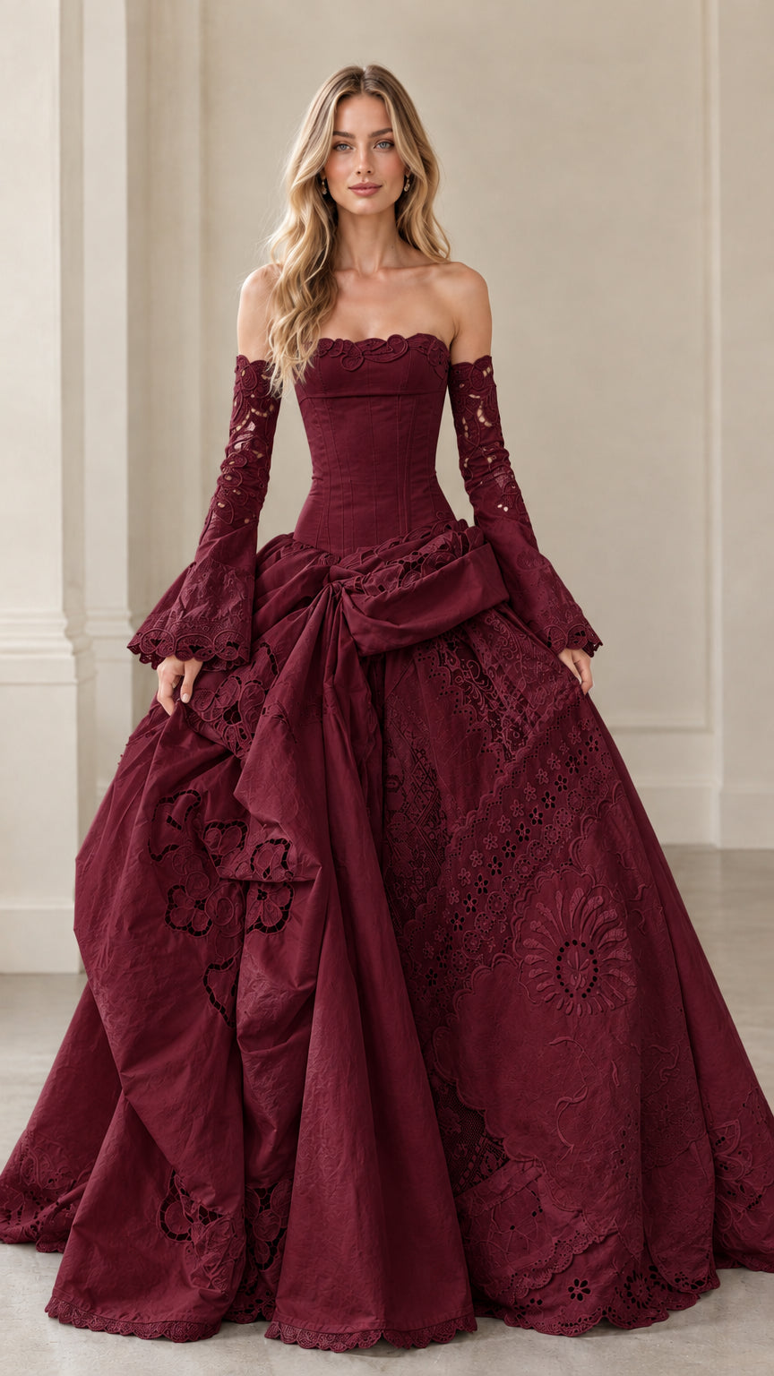 Front view of burgundy wine red corset ball gown with dramatic draped skirt
