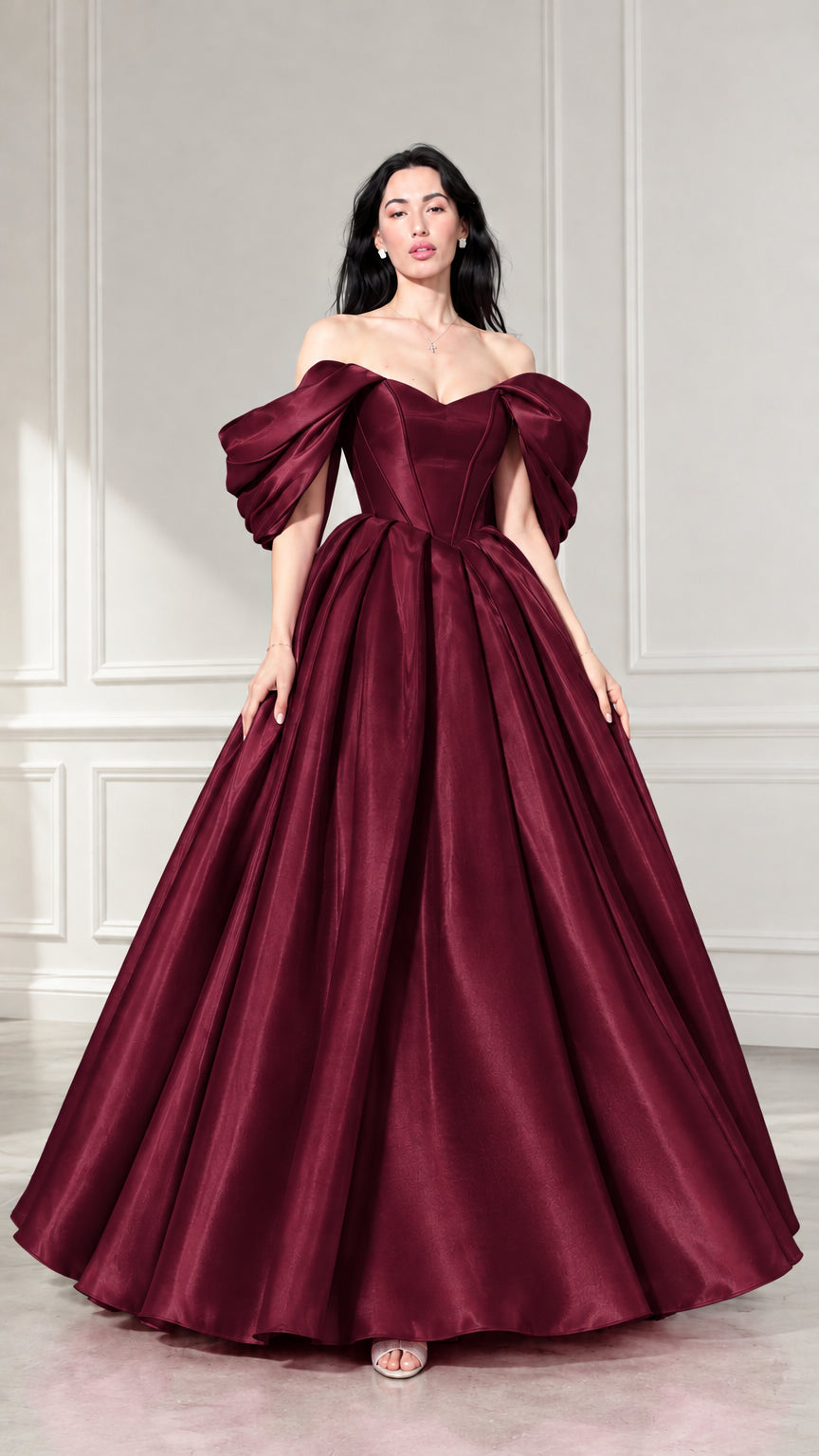 Front view of woman wearing burgundy off-the-shoulder corset ball gown