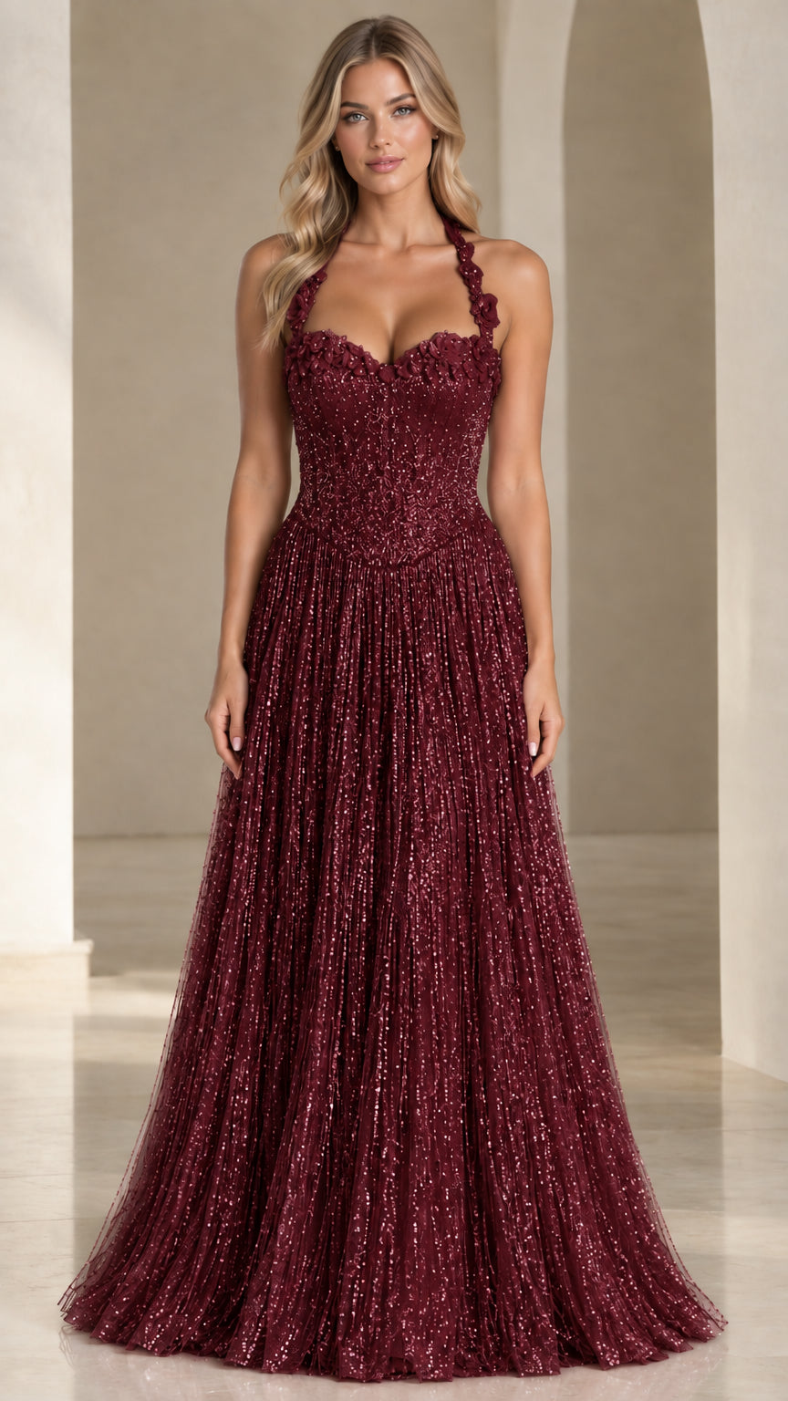 Front view of woman wearing burgundy wine floral applique halter sequin evening gown