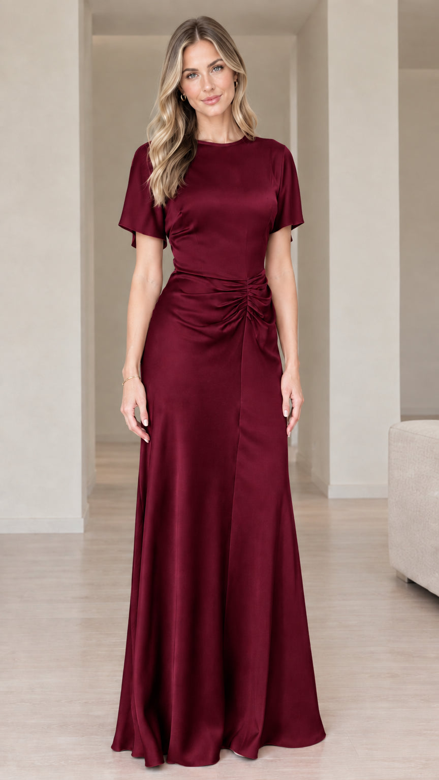 Front view of woman wearing burgundy wine red short sleeve satin dress