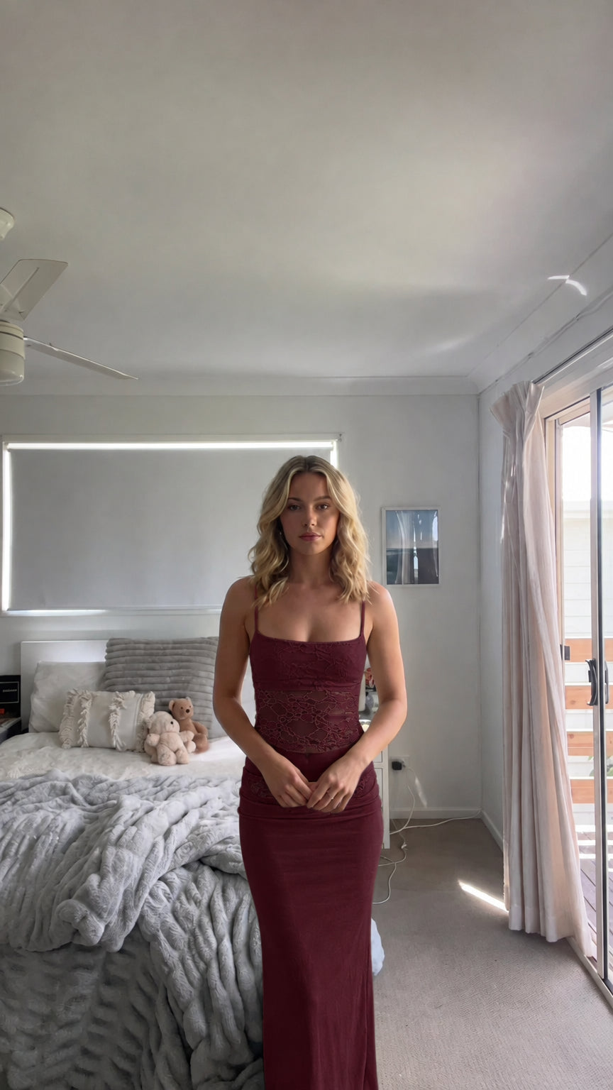 Model wearing burgundy wine red lace crop top and column maxi skirt set