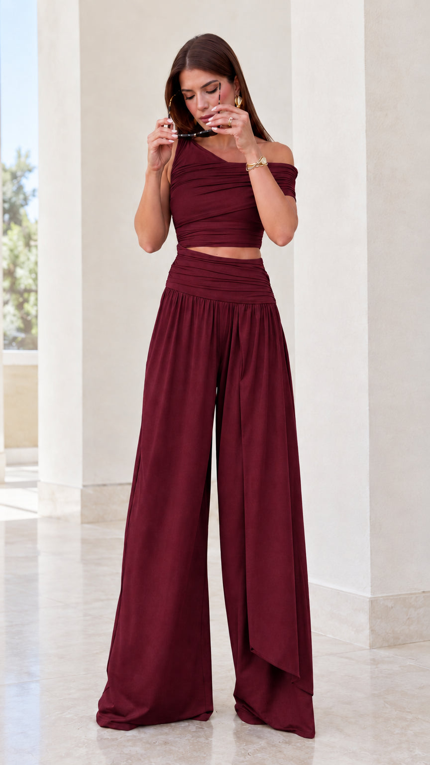 Front view of burgundy wine red ruched crop top and wide leg pant set