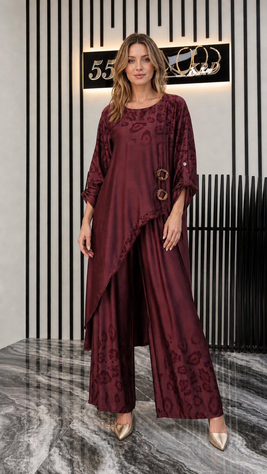 Front view of woman wearing burgundy wine asymmetrical tunic and pants set
