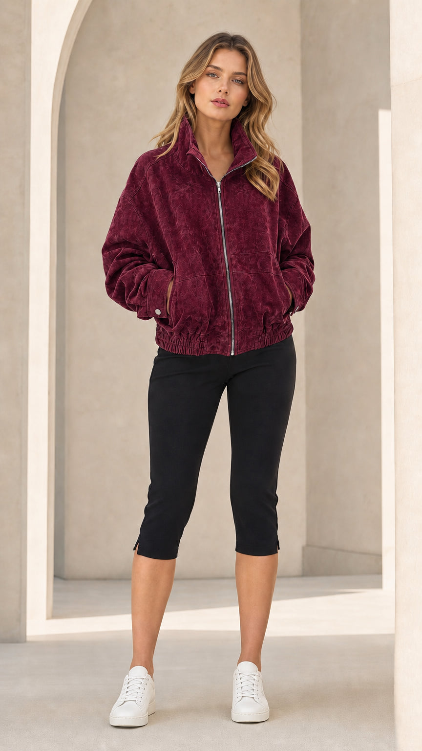 Front view of woman wearing Burgundy wine zip-up stand collar bomber jacket