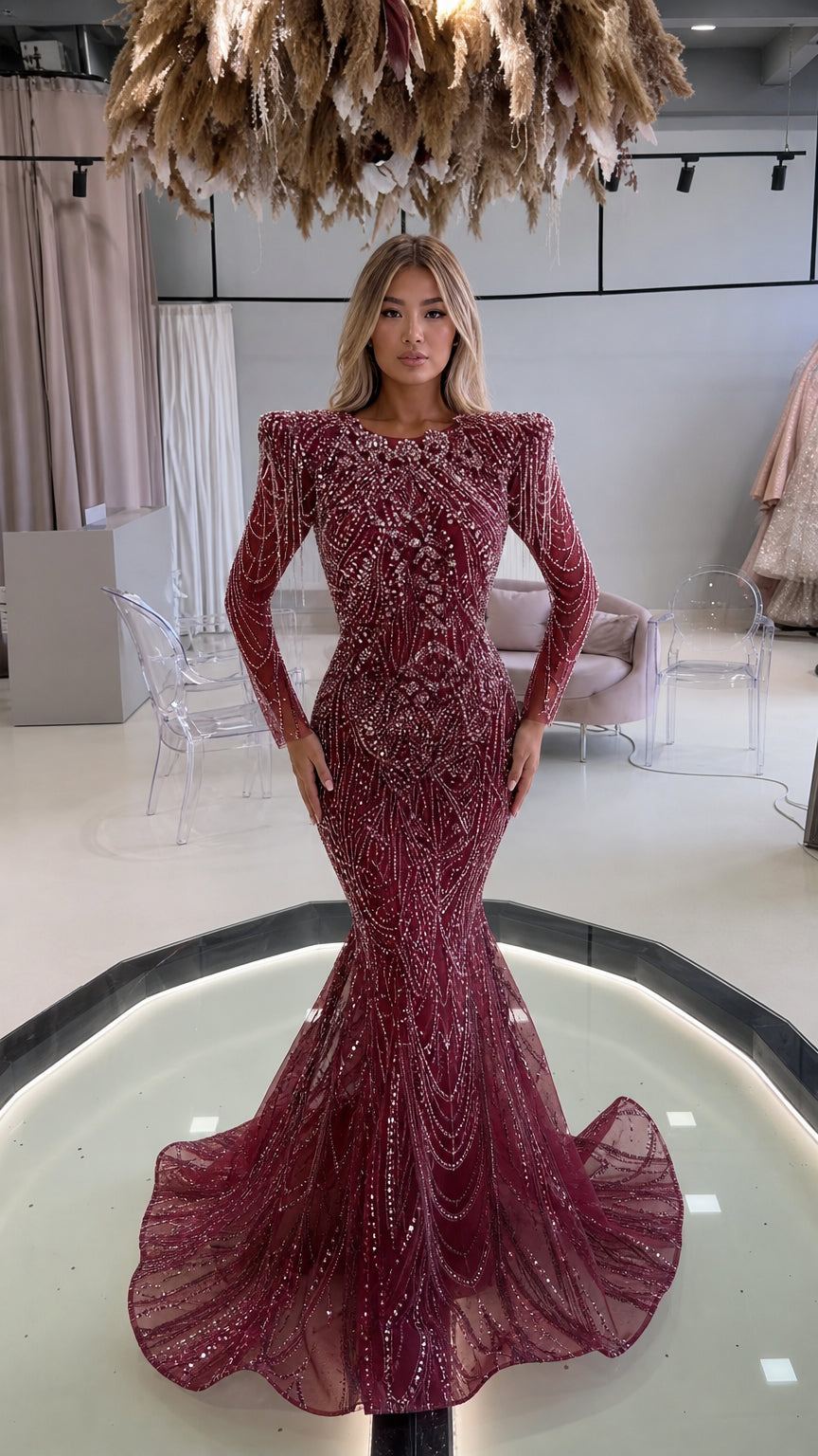 Front view of burgundy wine long-sleeve beaded mermaid evening gown with sweep train