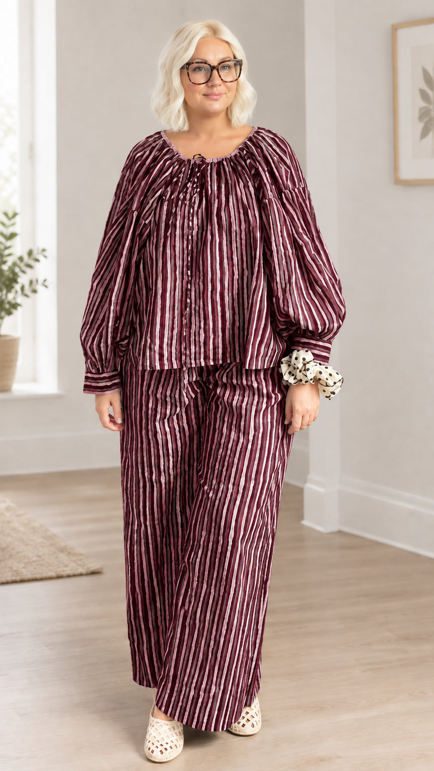 Full front view of model wearing burgundy wine striped two-piece pant set