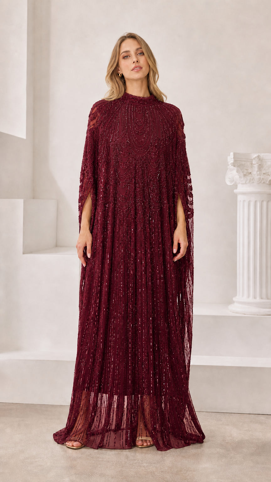Front view of burgundy red sequin cape sleeve formal dress