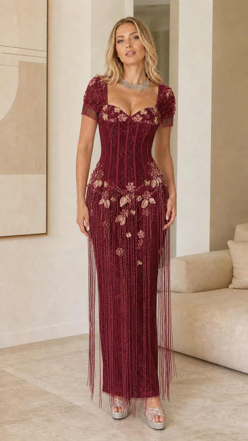 Model wearing Burgundy red floral embellished corset fringe maxi gown