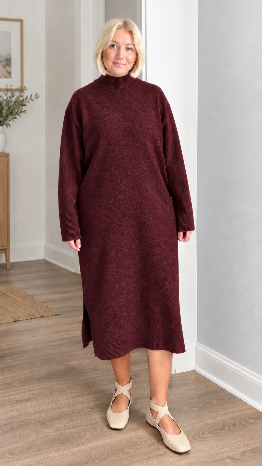 Front view of woman wearing rich burgundy wine mock neck knit midi sweater dress