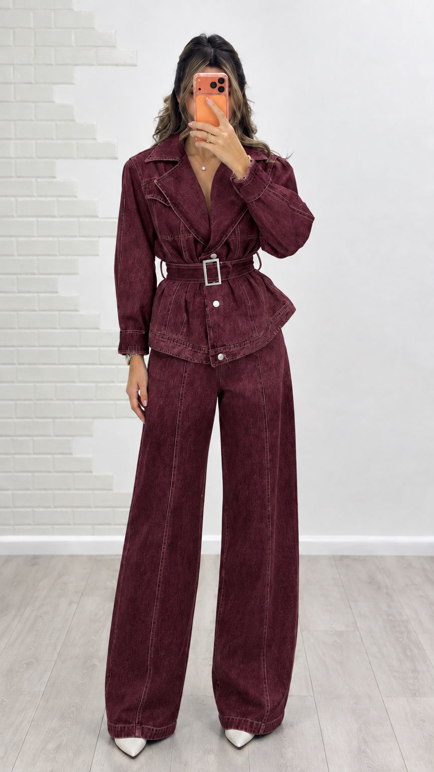 Model wearing burgundy wine red belted denim jacket and wide-leg jeans set
