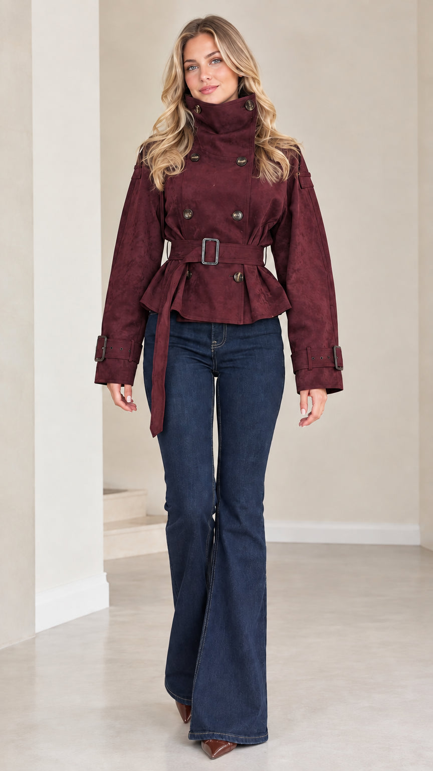 Front view of model wearing burgundy high neck belted cropped trench jacket