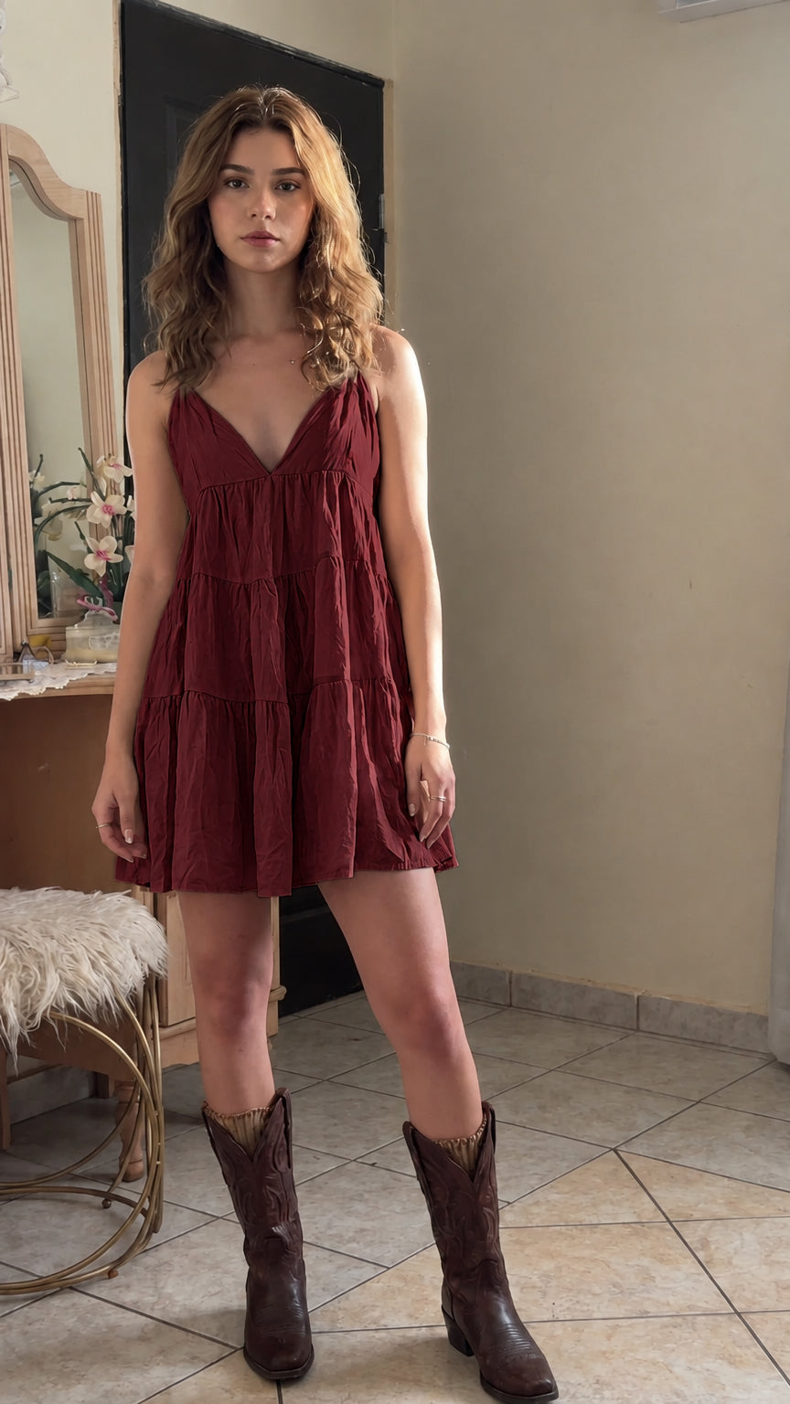 Model wearing burgundy red tiered crinkle cotton cami mini dress