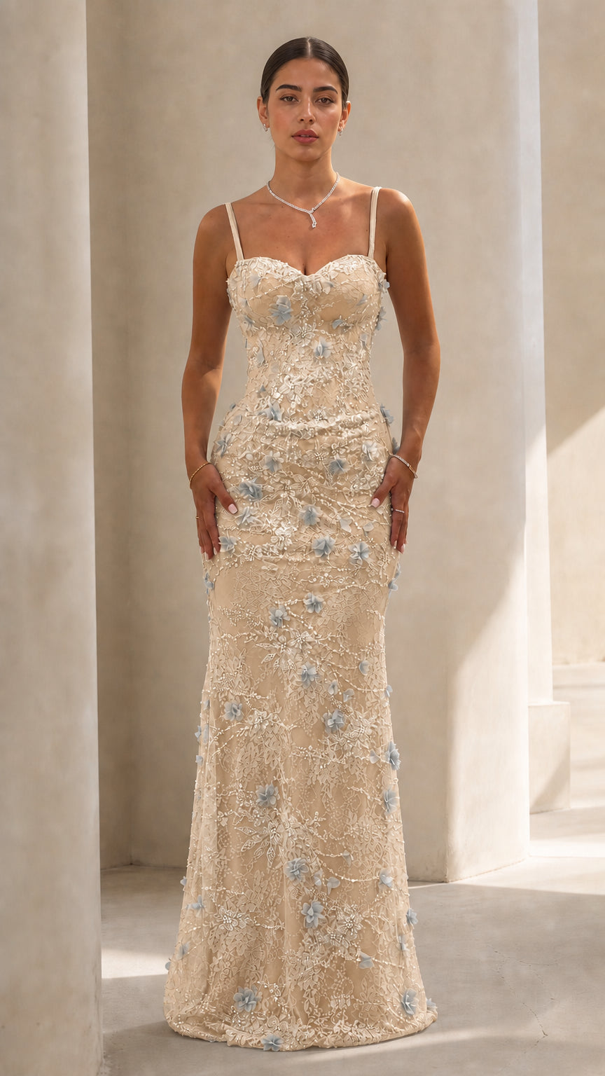 Front view of model in Champagne floral applique formal evening gown