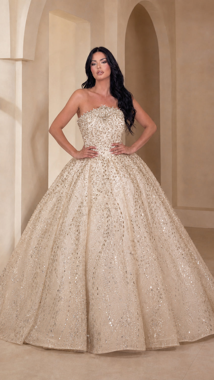 Model wearing champagne gold glittering strapless ball gown dress