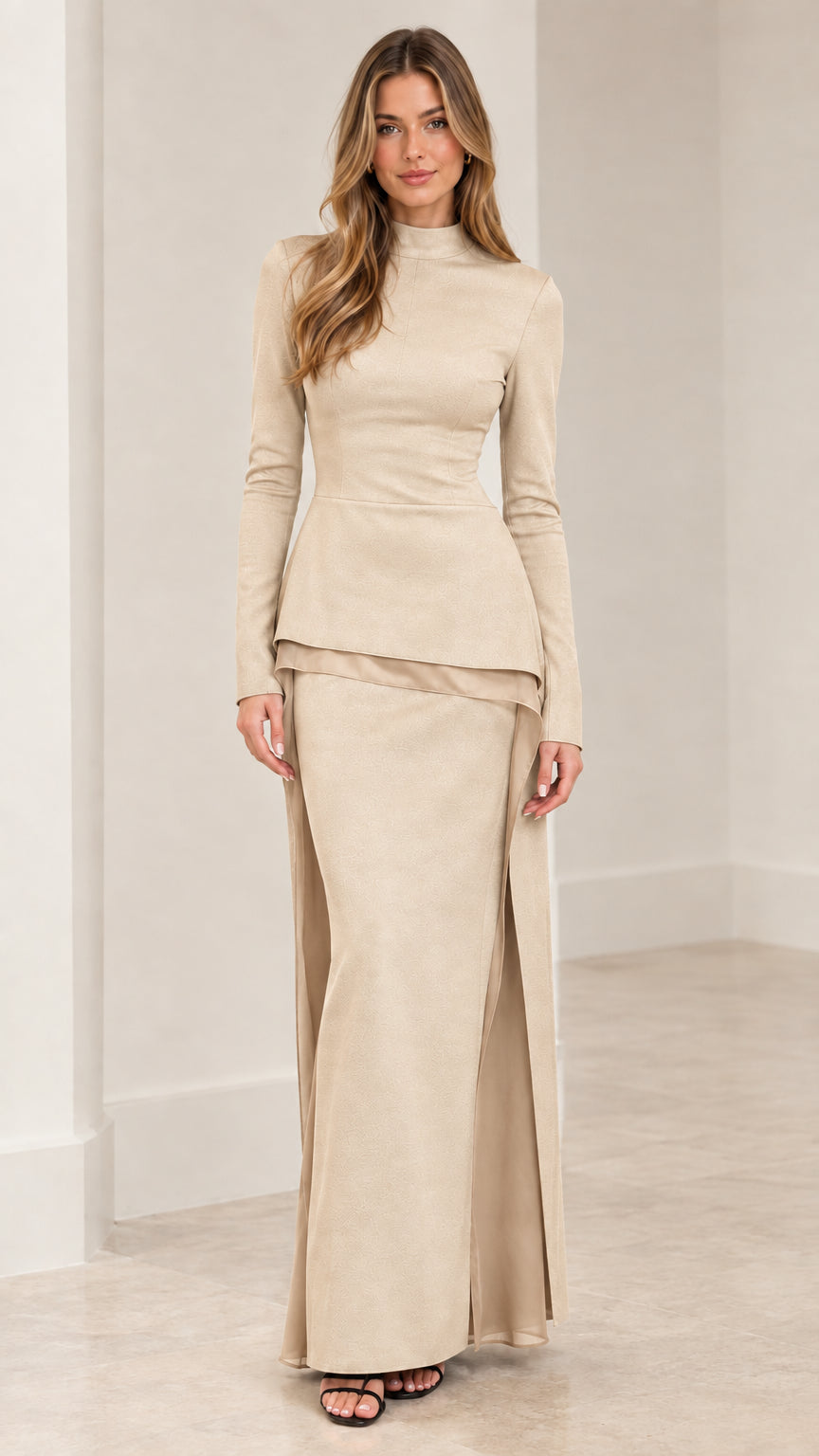 Front view of woman wearing beige cream long sleeve mock neck peplum top and maxi skirt set