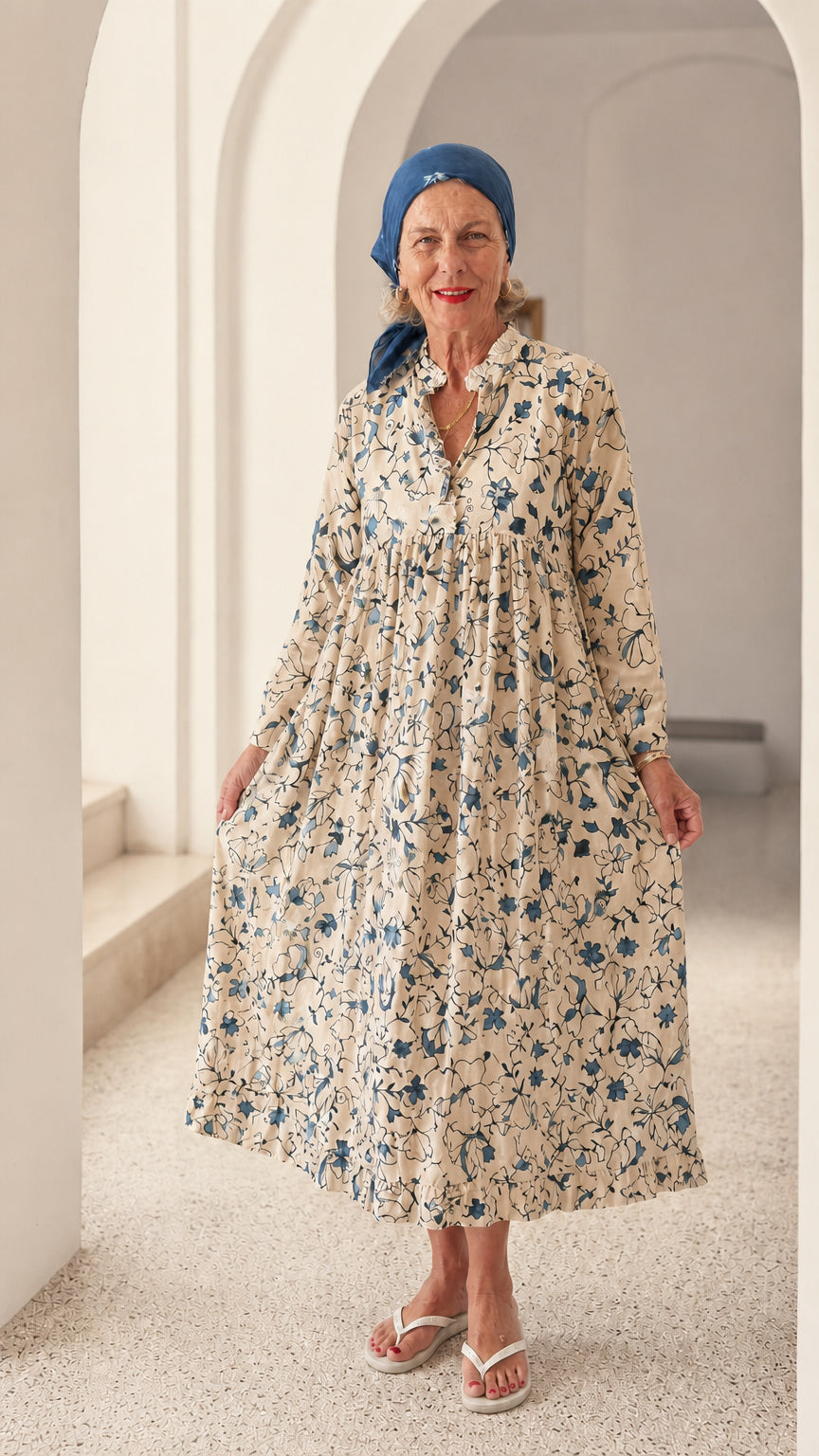 Front view of woman wearing Cream floral long sleeve relaxed midi dress