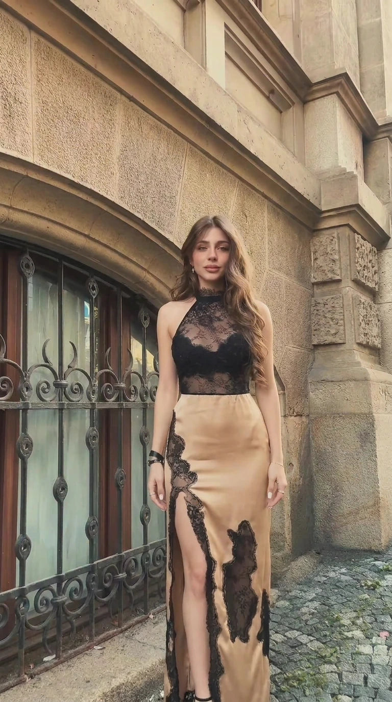 Front view of woman wearing champagne gold and black lace halter maxi dress
