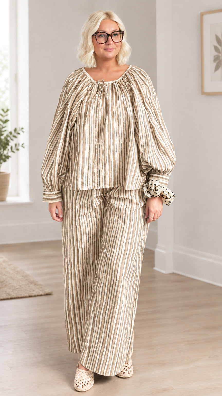 Full front view of model wearing beige and khaki striped two-piece pant set