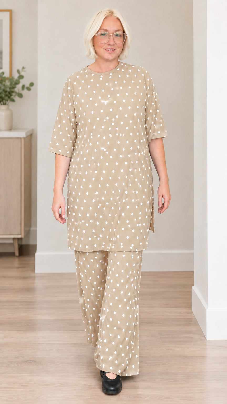Front view of woman wearing beige polka dot matching two-piece set