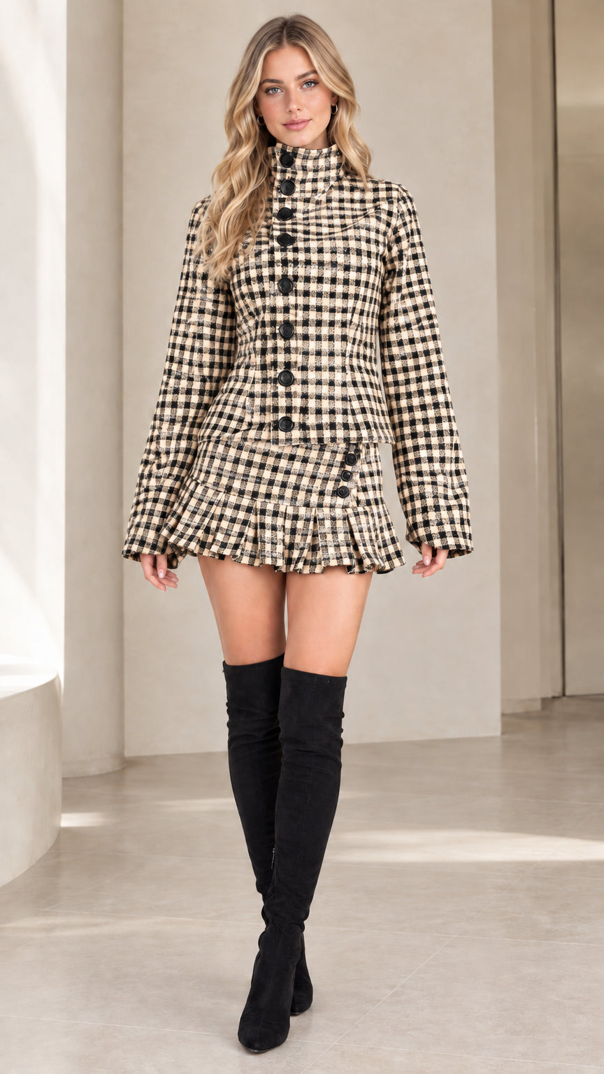 Front view of beige and black check high-neck jacket and pleated skirt set