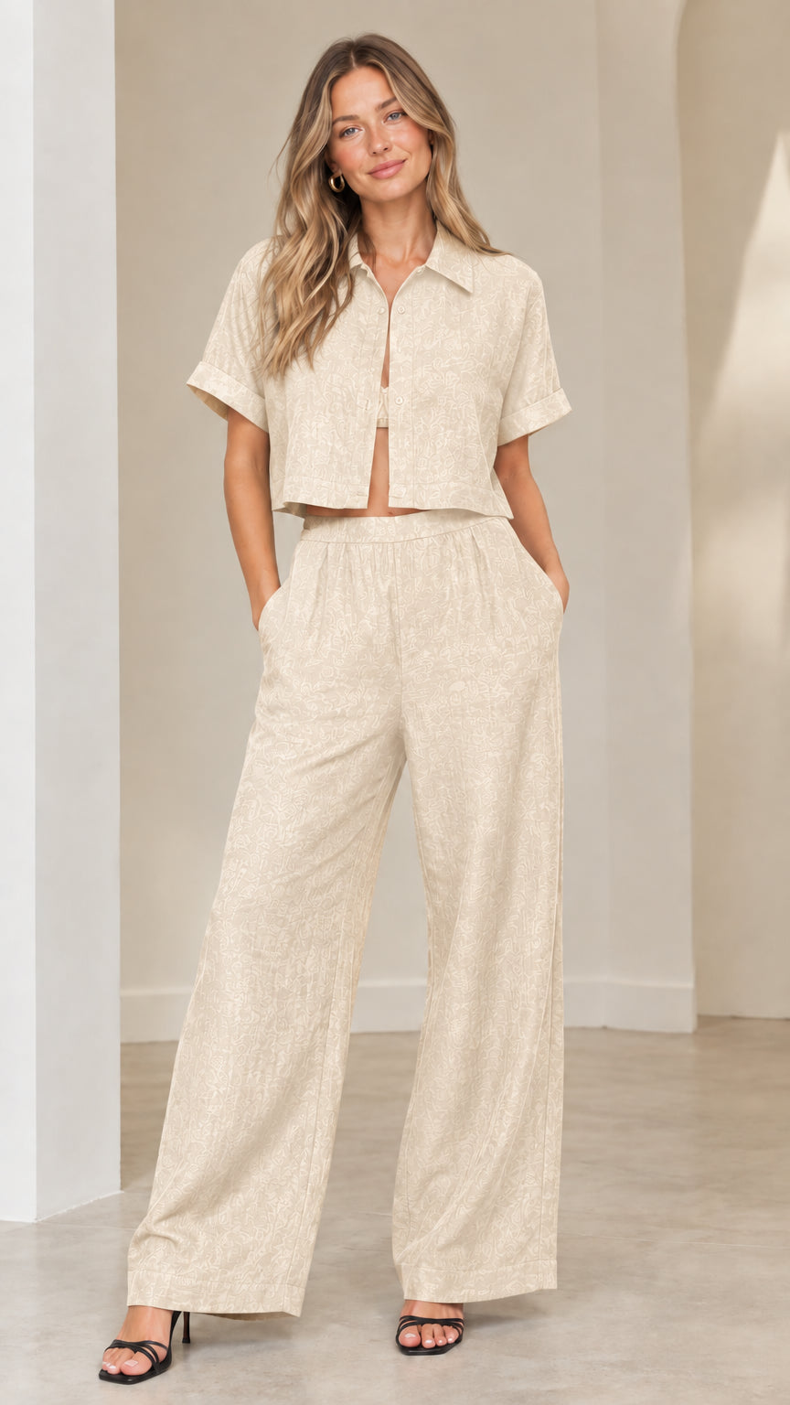 Front view of woman wearing beige oatmeal collared cropped top and wide-leg trousers two-piece set