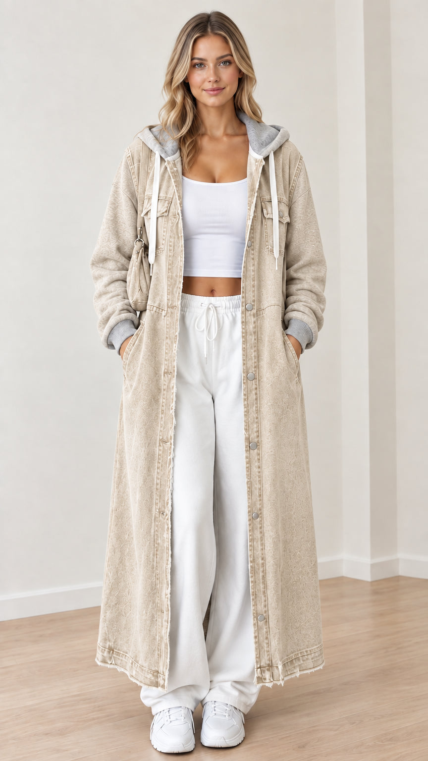 Front view of beige khaki maxi hooded denim coat with gray sweatshirt sleeves