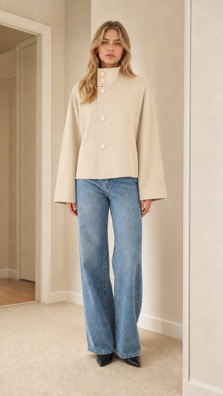Front view of model wearing cream off-white high neck cropped jacket