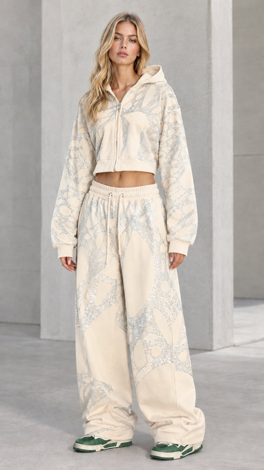 Full-body view of model wearing Cream rhinestone cropped hoodie and sweatpants set