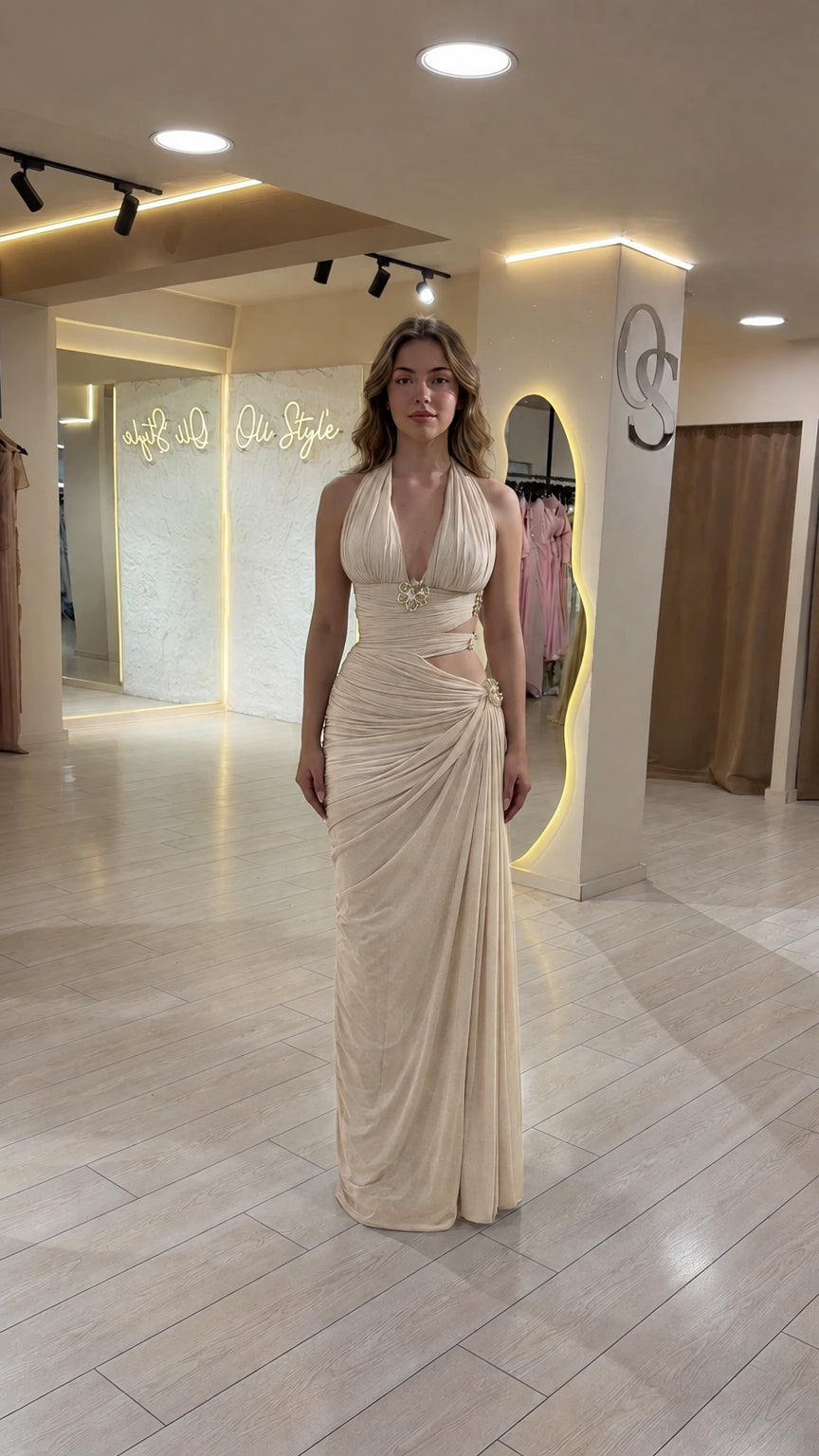 Model wearing champagne cream halter neck ruched cutout formal gown
