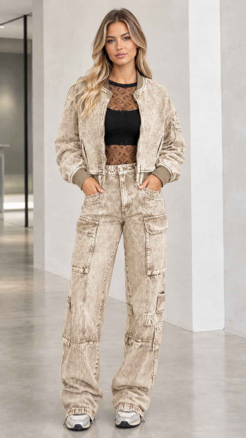 Full body front view of model wearing khaki beige washed denim bomber jacket and cargo pants set