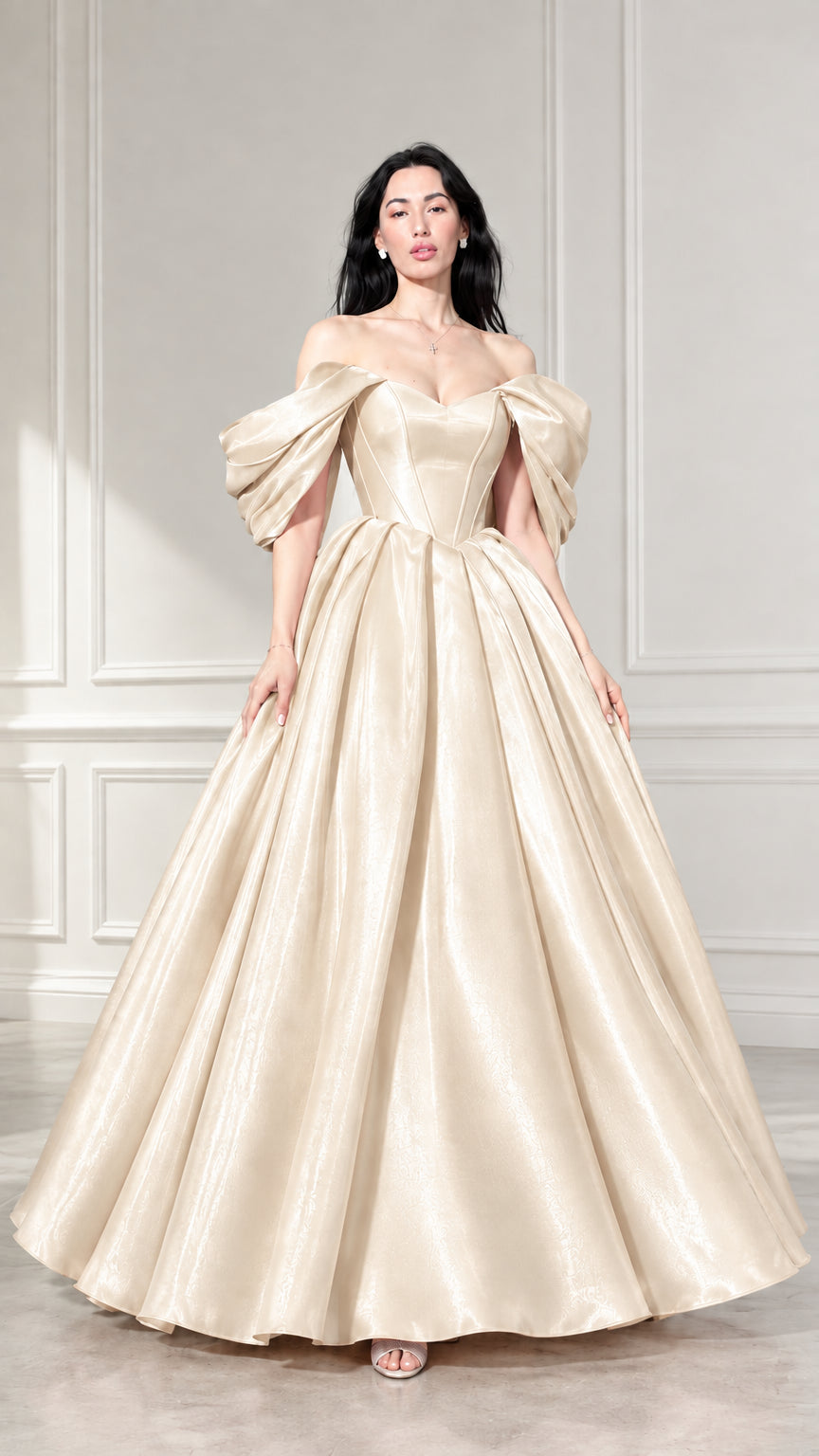 Front view of woman wearing champagne gold off-the-shoulder satin ball gown